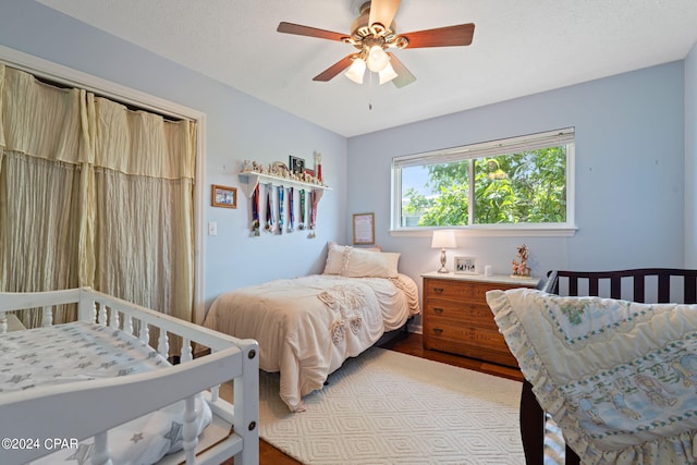 bedroom featuring ceiling fan and hardwood / wood-style flooring