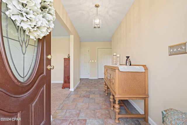 entryway featuring carpet floors