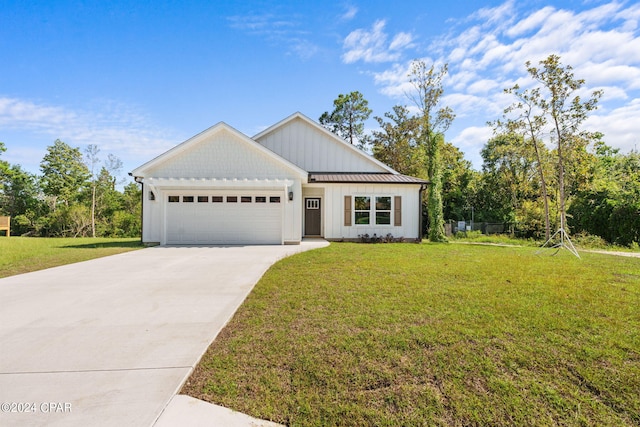 view of front of property with a front lawn and a garage