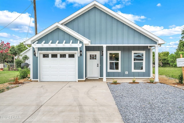 view of front facade with a garage and covered porch