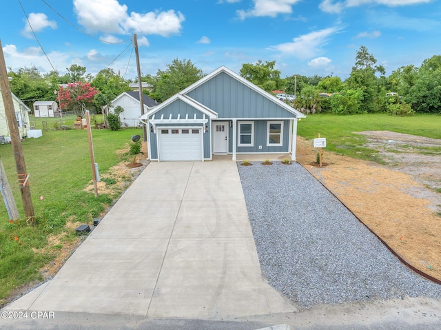 view of front facade with a garage and a front yard