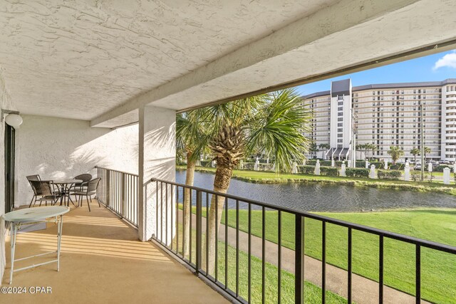 balcony featuring a water view