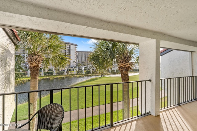 balcony featuring a water view