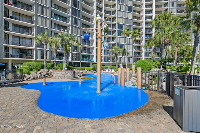 view of swimming pool featuring central AC unit