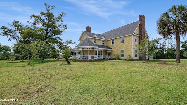 view of property exterior with a porch and a yard