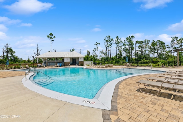 view of pool featuring a patio area