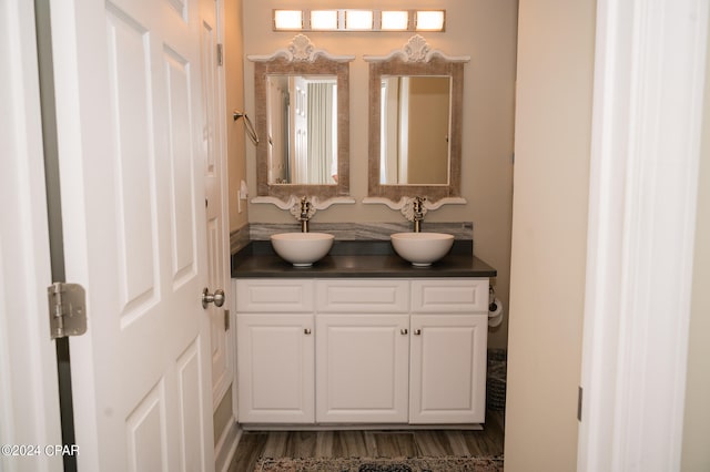 bathroom featuring hardwood / wood-style floors and vanity