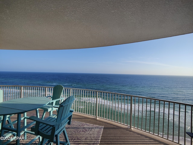 balcony featuring a water view