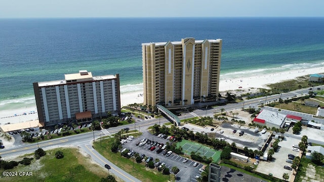 drone / aerial view featuring a view of the beach and a water view