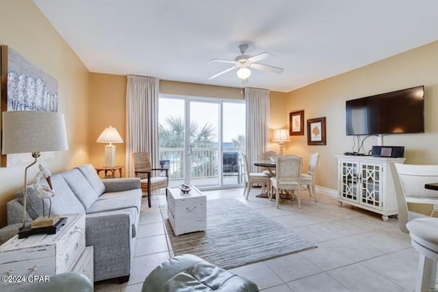 living room with ceiling fan and light tile patterned flooring