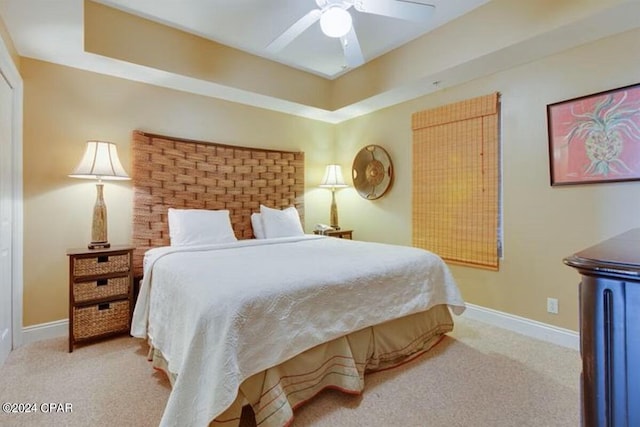 bedroom with ceiling fan and light colored carpet