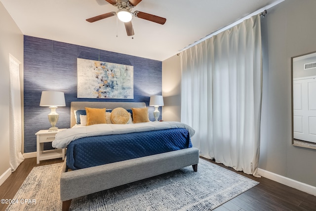 bedroom featuring dark wood-type flooring and ceiling fan