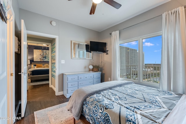 bedroom with dark wood-type flooring, multiple windows, and ceiling fan