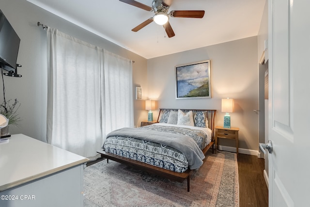 bedroom with ceiling fan and hardwood / wood-style flooring