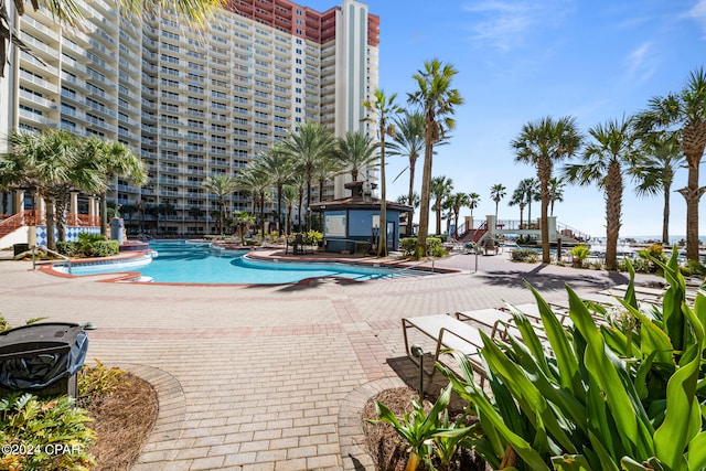 view of swimming pool featuring a patio area