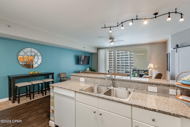 kitchen featuring white cabinetry, dark hardwood / wood-style flooring, ceiling fan, sink, and dishwasher