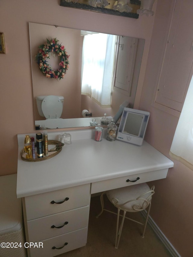 bathroom with vanity and toilet