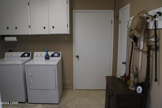 laundry area featuring cabinets and washer and dryer