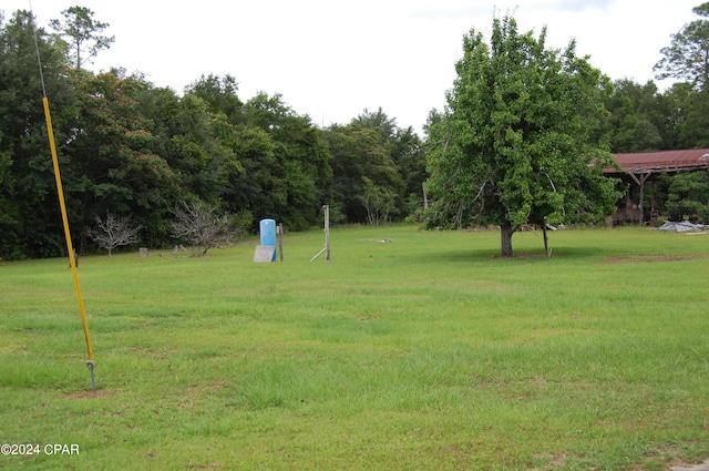 view of home's community featuring a lawn