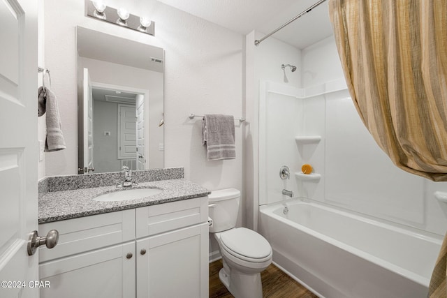 full bathroom featuring toilet, vanity, tub / shower combination, and wood-type flooring