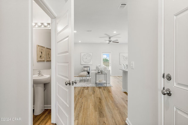 hall with light wood-type flooring