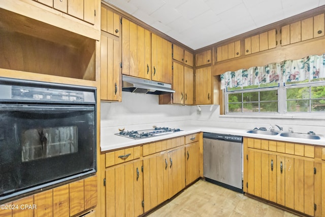 kitchen featuring light wood-type flooring, white gas cooktop, sink, dishwasher, and oven