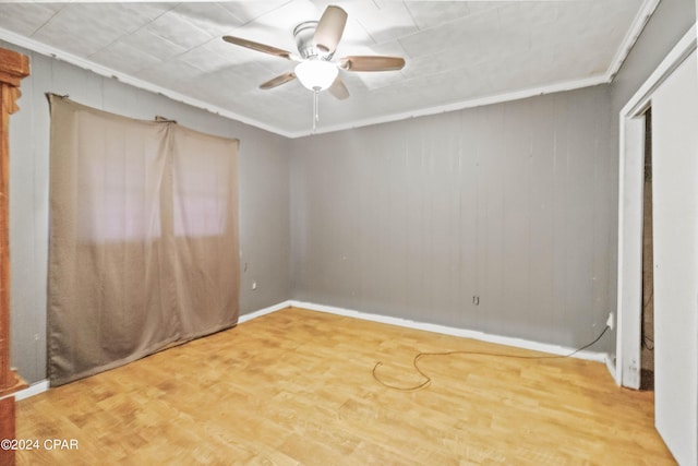 unfurnished bedroom with hardwood / wood-style floors, ceiling fan, and ornamental molding