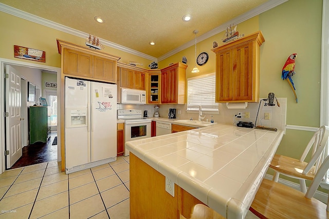 kitchen featuring white appliances, a textured ceiling, crown molding, light tile patterned floors, and tile countertops