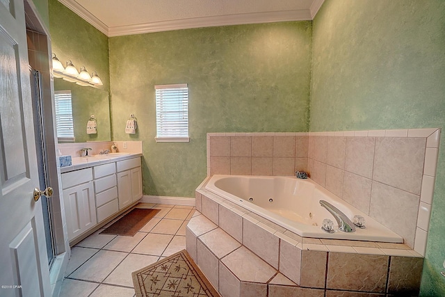 bathroom with tile patterned floors, vanity, crown molding, and tiled tub