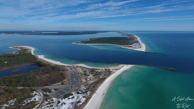 bird's eye view with a water view and a view of the beach