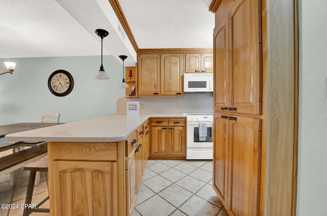 kitchen with range, a breakfast bar area, kitchen peninsula, and decorative light fixtures