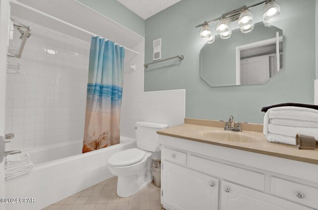 full bathroom featuring vanity, tile patterned flooring, toilet, and shower / bath combination with curtain