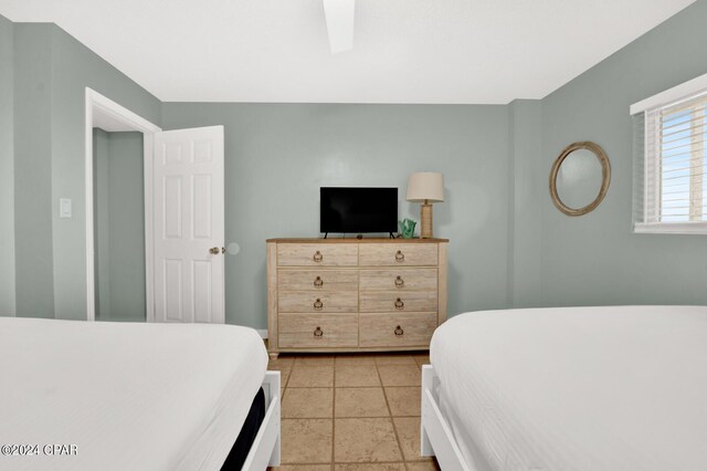 bedroom with light tile patterned flooring and ceiling fan