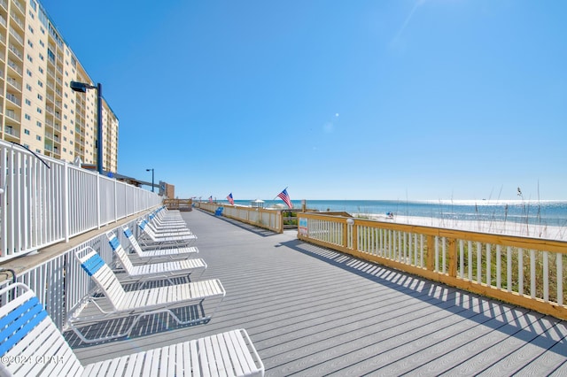 deck featuring a water view and a view of the beach