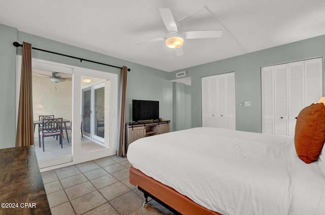 bedroom featuring ceiling fan, access to outside, and multiple closets