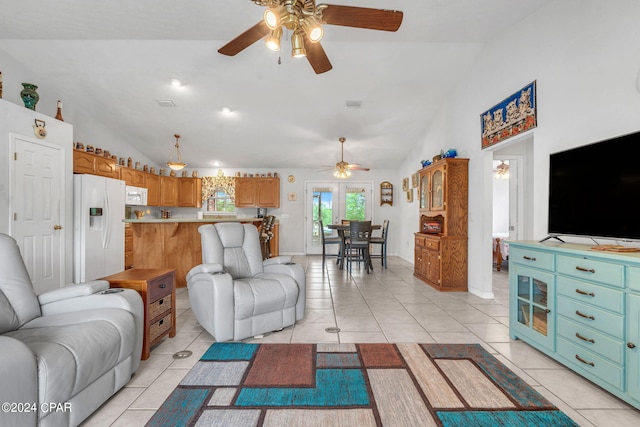 living room featuring light tile patterned floors, high vaulted ceiling, and ceiling fan