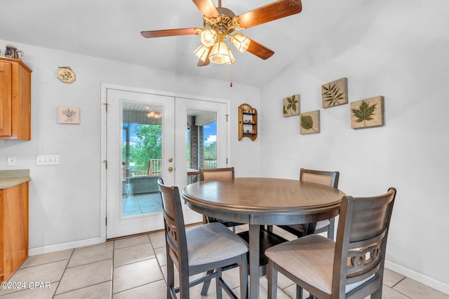 dining area featuring ceiling fan, light tile patterned floors, and french doors