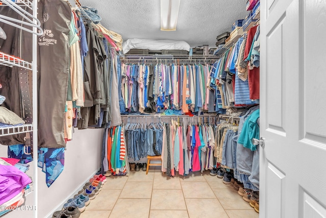 spacious closet with tile patterned flooring