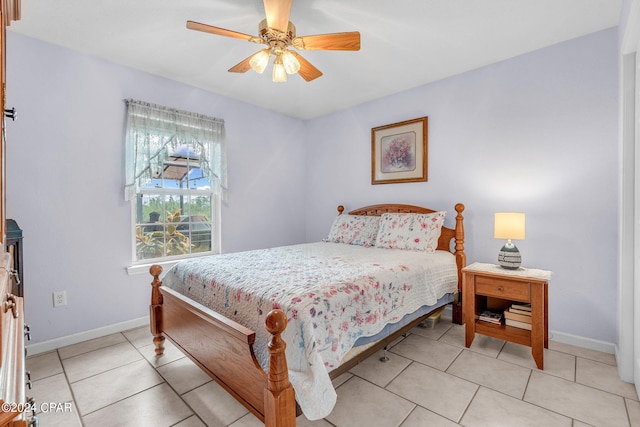 bedroom featuring light tile patterned floors and ceiling fan