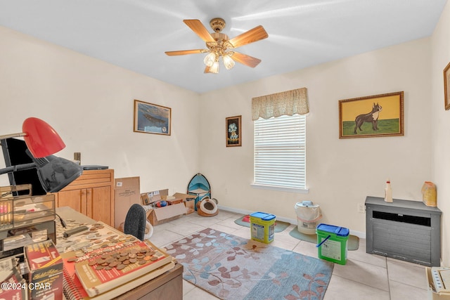 office area with ceiling fan and light tile patterned flooring