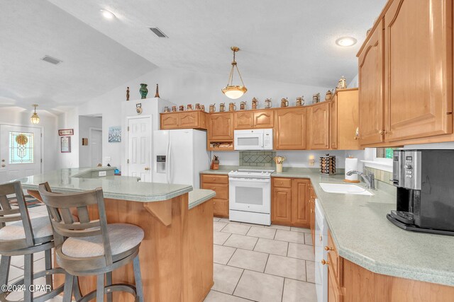 kitchen with white appliances, sink, tasteful backsplash, and vaulted ceiling