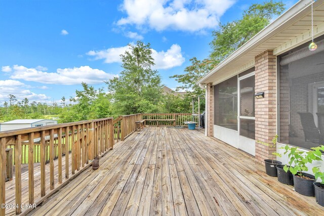 deck featuring a sunroom