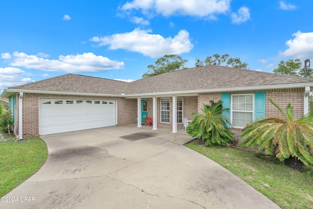 single story home with a garage and a front yard