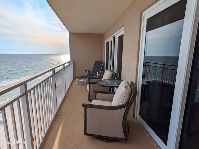 balcony featuring a water view