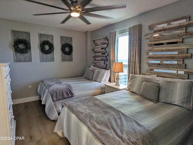 bedroom with ceiling fan and hardwood / wood-style floors