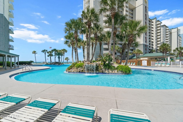 view of pool with pool water feature