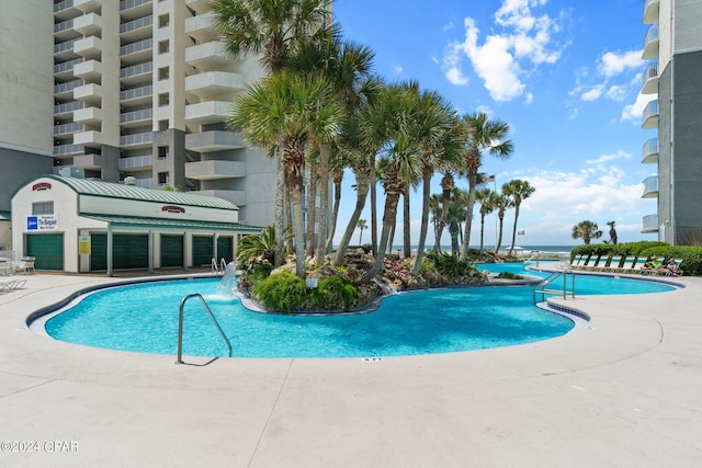 view of pool featuring pool water feature