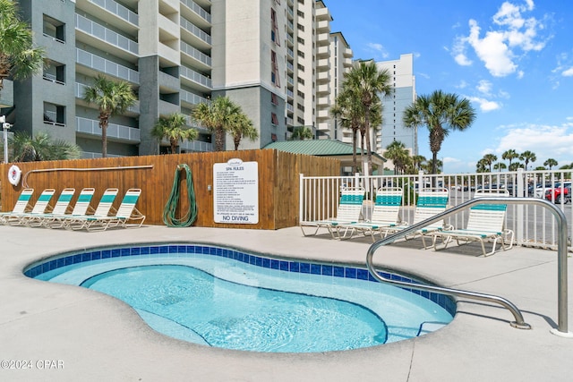 view of swimming pool with a patio