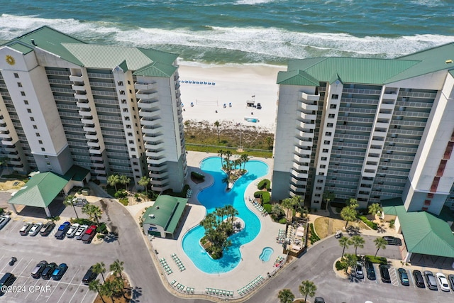 bird's eye view featuring a view of the beach and a water view