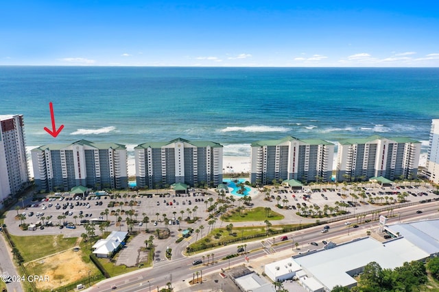 aerial view with a water view and a beach view